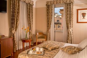מיטה או מיטות בחדר ב-Albergo Ottocento