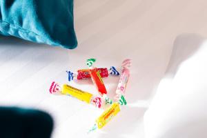 a group of four toothbrushes on a white table at Hotel Haussmann Saint Augustin in Paris