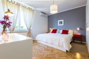 Łóżko lub łóżka w pokoju w obiekcie Apartments Tomislav Primorska