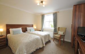 Un pat sau paturi într-o cameră la Marton Grange Country House