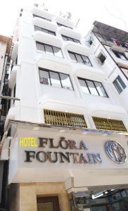 a hotel sign on the front of a building at Hotel Flora Fountain,Fort in Mumbai