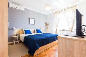 Łóżko lub łóżka w pokoju w obiekcie Apartments Tomislav Primorska