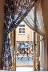 a window with a table on a balcony at Angel House Vilnius, Pilies in Vilnius