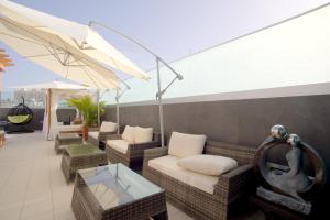 A seating area at Valentina Beach