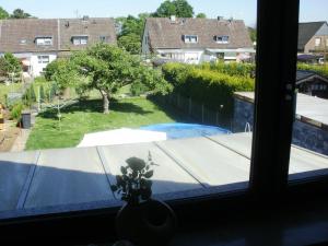 a window with a view of a swimming pool at Apartment Monika in Frechen