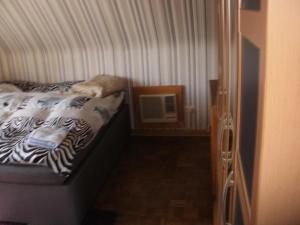 Tempat tidur dalam kamar di Apartment Monika