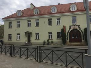 a building with a fence in front of it at Vilnius Symphony Apartments in Vilnius