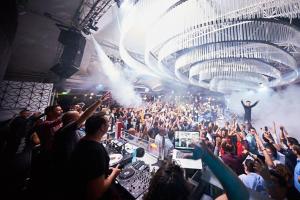 a crowd of people at a concert with a man on the stage at Voyage Residence in Mamaia