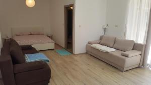 a living room with a couch and a bed at Apartment Antonija i Mateo, Apartment in the center of Split rooms in Split