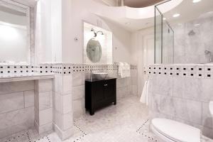 a bathroom with a shower and a sink and a toilet at Eastover Estate and Eco Village in Lenox +41 photos