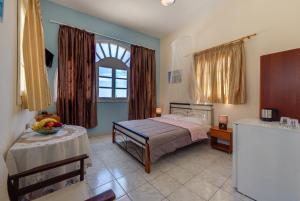 A bed or beds in a room at Onar Rooms & Studios