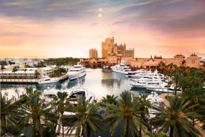 a group of boats docked in a marina at The Royal at Atlantis in Nassau