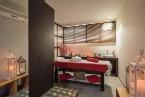 A bed or beds in a room at Hotel Fedora Riccione