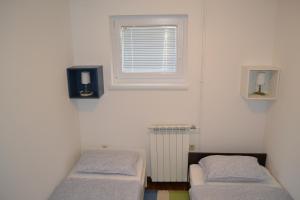 מיטה או מיטות בחדר ב-Apartment Luli
