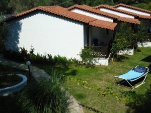 avisor shot of a house with a chair in a yard at Hotel Zachos in Troulos