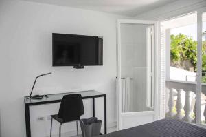TV a/nebo společenská místnost v ubytování Muta House