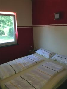 Llit o llits en una habitació de Ferienhaus zur Blautanne