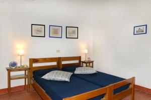 Postel nebo postele na pokoji v ubytování Agriturismo Tenuta Vallelunga