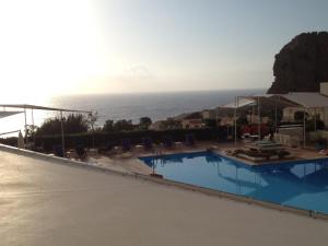 a swimming pool with a view of the ocean at Casa Mamma Bruna in San Vito lo Capo
