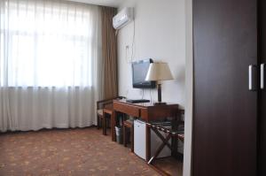 TV a/nebo společenská místnost v ubytování King Parkview Hotel