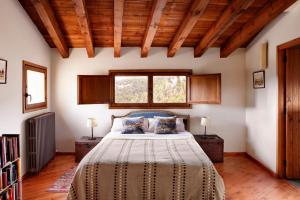 A bed or beds in a room at Hotel Mas de la Serra