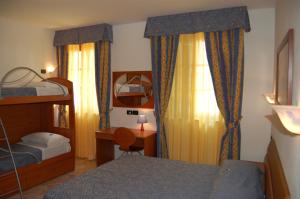 Postel nebo postele na pokoji v ubytování Hotel Anfora