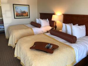 A bed or beds in a room at Norfolk Country Inn and Suites