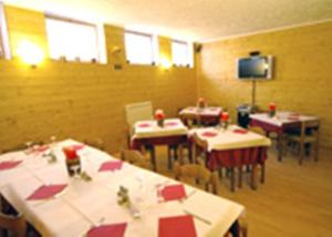 Un restaurant sau alt loc unde se poate mânca la Hotel La Pigna
