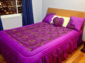 Postel nebo postele na pokoji v ubytování Hostal Mirador de Otavalo