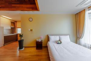 Postel nebo postele na pokoji v ubytování Harmony Resort