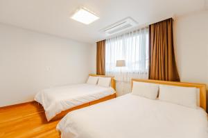 Postel nebo postele na pokoji v ubytování Harmony Resort