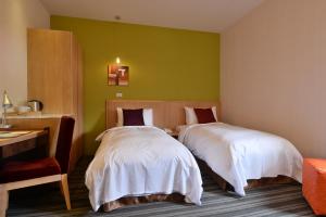 Postel nebo postele na pokoji v ubytování In Young Hotel
