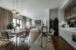a kitchen and dining room with a table and chairs at Milano Central Luxury in Milan