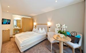 Postel nebo postele na pokoji v ubytování Hotel Schennerhof