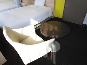 Postel nebo postele na pokoji v ubytování Smile Hotel Utsunomiya Higashiguchi