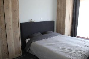 Krevet ili kreveti u jedinici u objektu "Zonnesteiger" ruim appartement met parking
