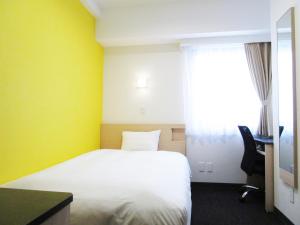 Postel nebo postele na pokoji v ubytování Smile Hotel Utsunomiya Higashiguchi