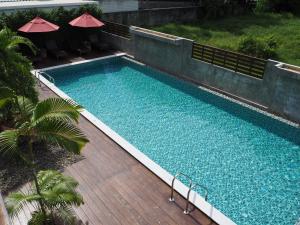 an overhead view of a swimming pool on a wooden deck at Crystal Lamai Hotel in Lamai