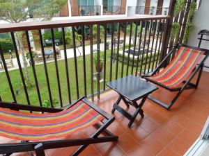two chairs and a table on a balcony at Crystal Lamai Hotel in Lamai