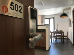 a kitchen with a stainless steel oven and a table at Residence Kalliste in Ajaccio