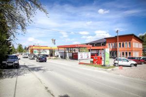 a street with cars parked on the side of the road at Becar Pyramids B&B in Visoko