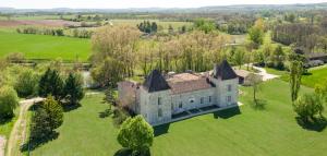 an aerial view of a castle in a field at Chateau Secretary in Monflanquin