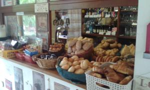 a bakery with lots of different types of bread at Camping Matyáš in Vrané nad Vltavou