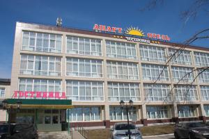 a large building with an atari one ends sign on it at Apart Hotel Cherepovets in Cherepovets