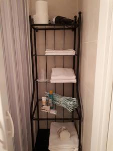 a towel rack in a bathroom with towels at B&B Sara e Angela in Salerno