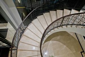 a spiral staircase in a building at Samala Hotel Jakarta Cengkareng in Jakarta