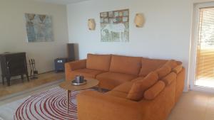 a living room with a couch and a table at Domido Villa in Trakai