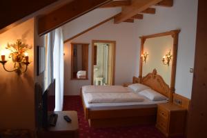 Postel nebo postele na pokoji v ubytování Hotel Tannhof