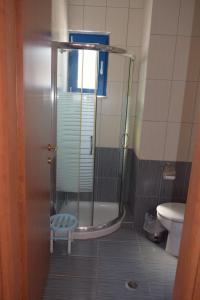 a bathroom with a shower and a toilet at Ellibay in Livadia