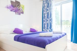 Letto o letti in una camera di Apartments Nikolina